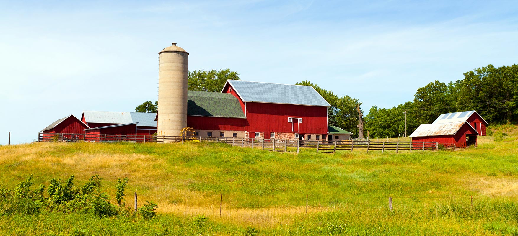 Barn with silo on hill